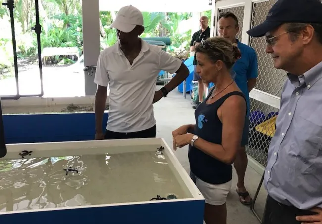 Cecile Gaspar of Te Mana o Te Moana, with Richard Bailey of Pacific Beachcomber, talking to Barack Obama about the Green Sea Turtle Monitoring program.